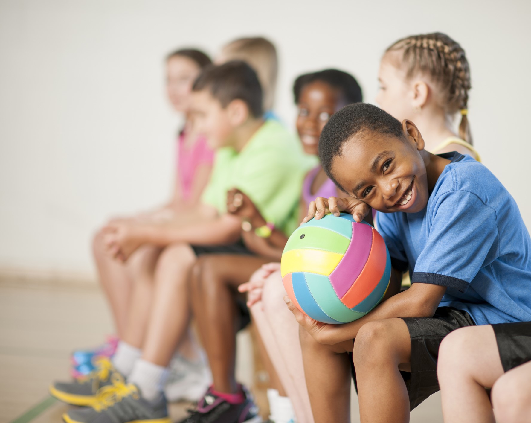 smiling boy holding basketball