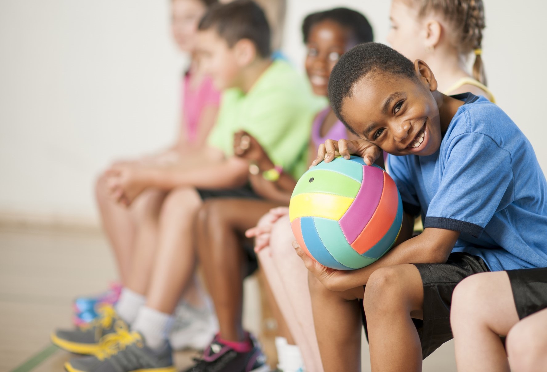 smiling boy holding basketball