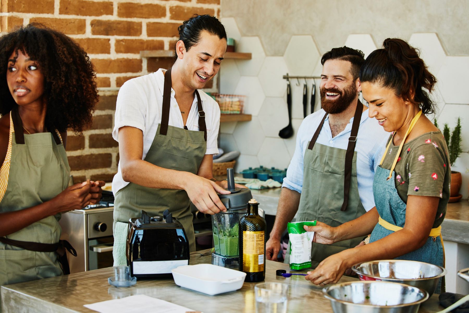 group of people taking a cooking class together