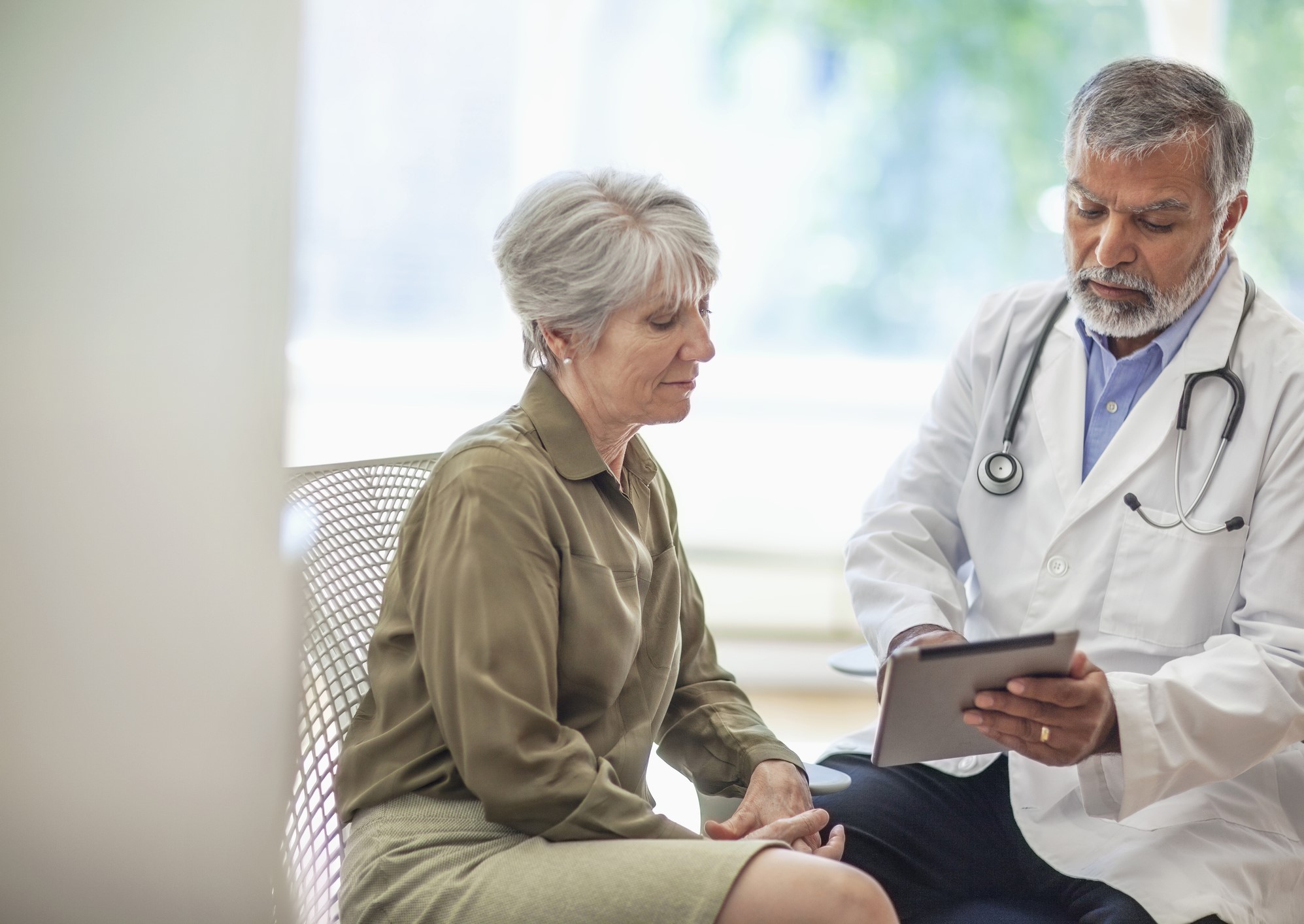 woman discussing with her doctor