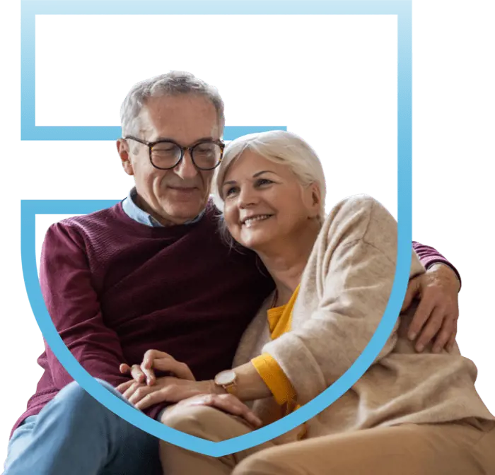 older couple hugging happily