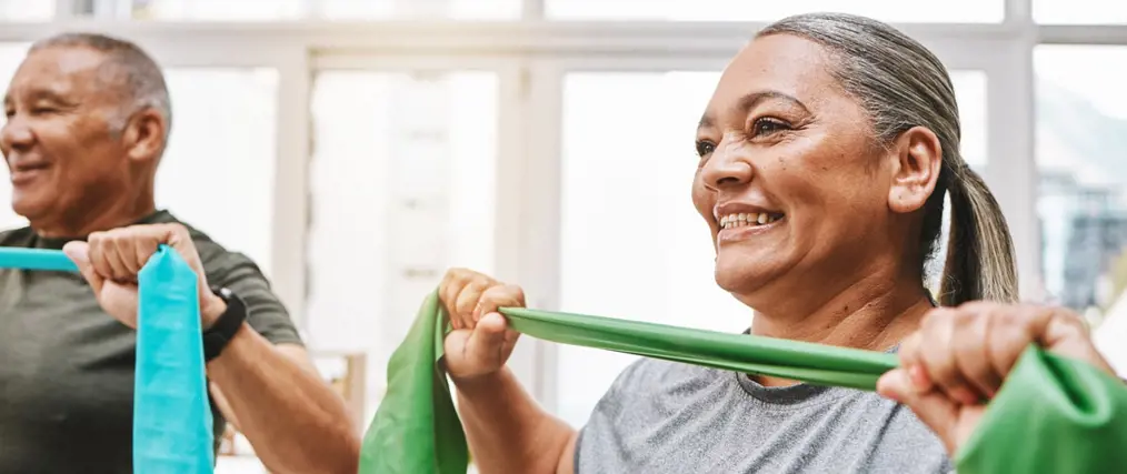 smiling older adults exercising